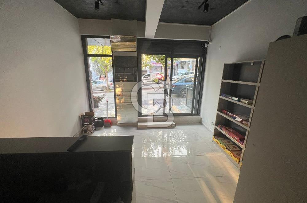 BORNOVA CADDE ÜZERİNDE SATILIK TİCARİ RUHSATLI DÜKKAN