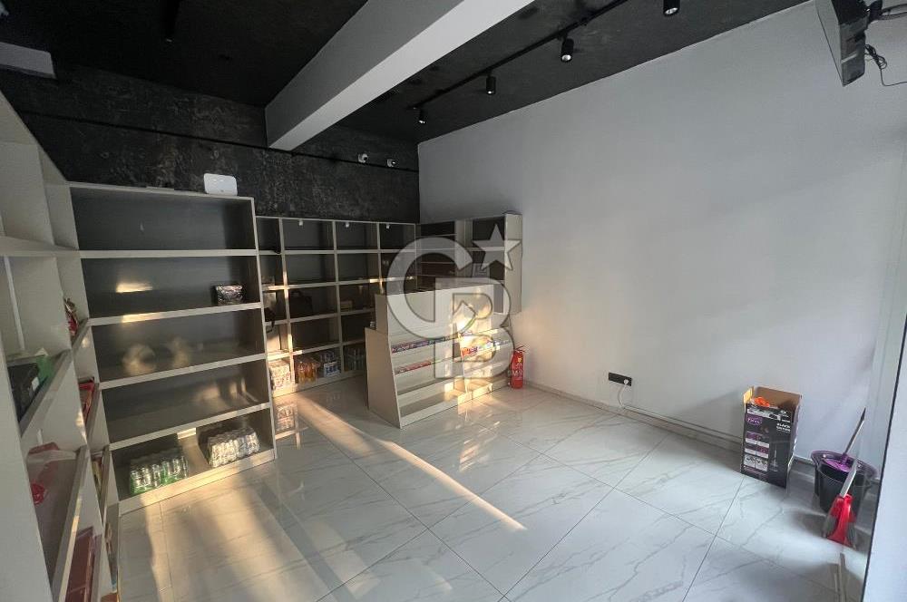 BORNOVA CADDE ÜZERİNDE SATILIK TİCARİ RUHSATLI DÜKKAN