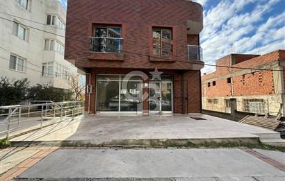 Bornova’da Satılık Altı Dükkan Üstü Daire Olan İki Katlı Bina