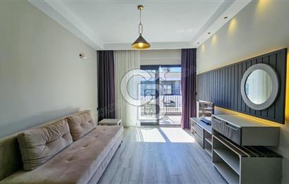 Kuşadası Kuştur Plajı ‘na Yürüme Mesafesinde 1+1 şık eşyalı kiralık daire