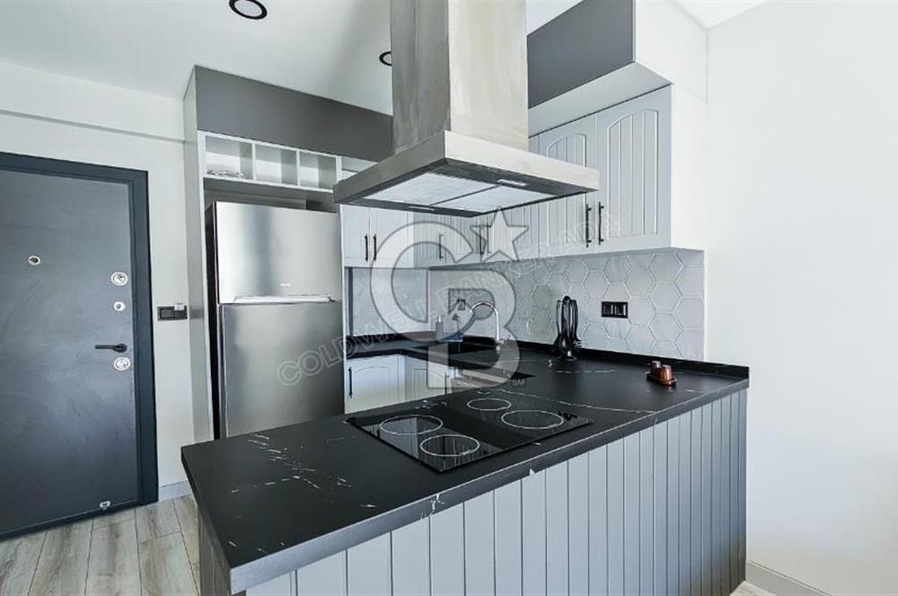 Kuşadası Kuştur Plajı ‘na Yürüme Mesafesinde 1+1 şık eşyalı kiralık daire