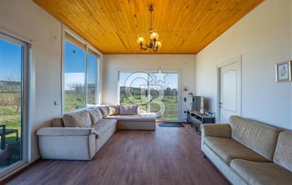 FOÇA GERENKÖY'DE MÜSTAKİL TAPULU SATILIK TARLA ÜZERİNDE 3+1 YAPI