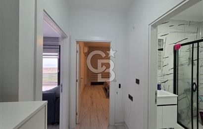 AYVALIK ALTINOVADA DENİZ MANZARALI HAVUZLU SİTEDE 1+1 EŞYALI