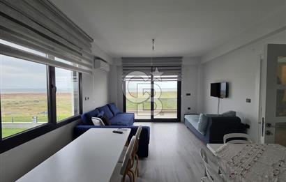 AYVALIK ALTINOVADA DENİZ MANZARALI HAVUZLU SİTEDE 1+1 EŞYALI