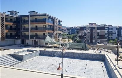 KUŞADASI İKİÇEŞMELİK MAHALLESİNDE OTOPARKLI GÜVENLİKLİ YENİ 1+1  DAİRE