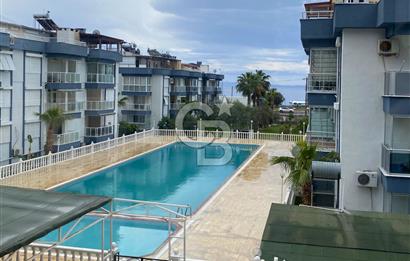 ALTINOLUK’TA HAVUZLU DENİZE 50 M. HAVUZLU SİTE İÇİNDE SATILIK 2+1 DAİRE