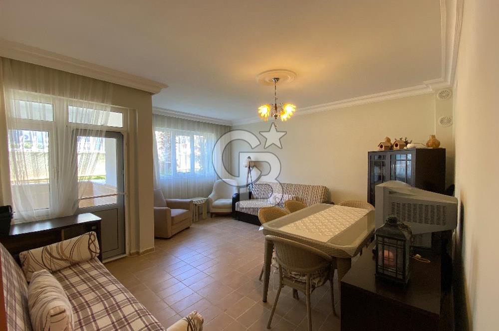 ALTINOLUK’TA HAVUZLU DENİZE 50 M. HAVUZLU SİTE İÇİNDE SATILIK 2+1 DAİRE