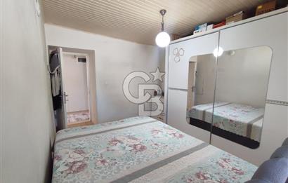 Ayvalık Mutluköy'de Satılık müştemilatlı müstakil ev ve arsa