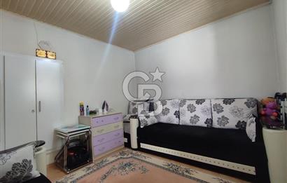 Ayvalık Mutluköy'de Satılık müştemilatlı müstakil ev ve arsa