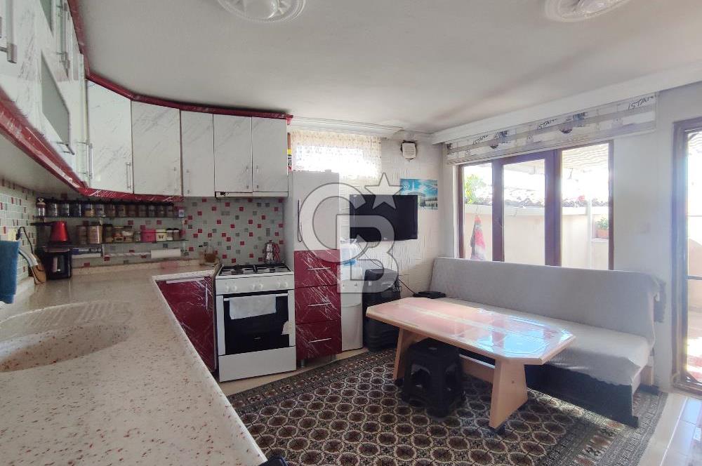 Ayvalık Mutluköy'de Satılık müştemilatlı müstakil ev ve arsa