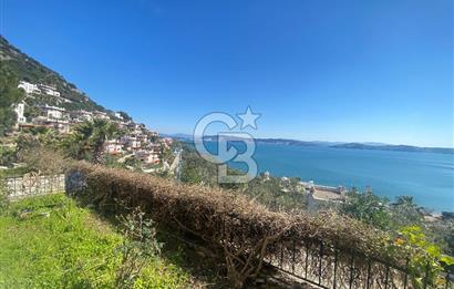 KIYIKIŞLACIK TA DENİZ MANZARALI GÜLÜMKIYI SİTESİNDE PLAJLI 3+1 BAHÇELİ TRİPLEKS VİLLA