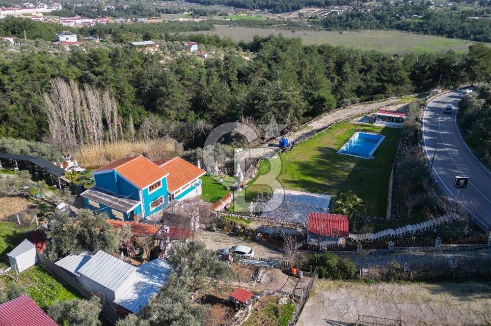 BUCA KAYNAKLAR BELENBAŞIN’DA İÇERİSİNDE RUHSATLI IŞLATME BULUNAN SATILIK 11 Dönüm TARLA 