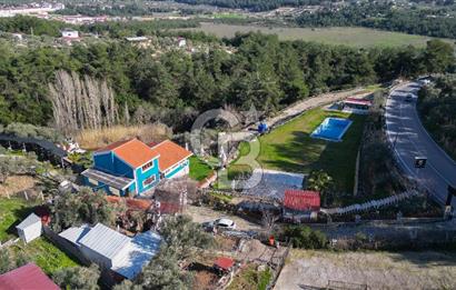 BUCA KAYNAKLAR BELENBAŞIN’DA İÇERİSİNDE RUHSATLI IŞLATME BULUNAN SATILIK 11 Dönüm TARLA 