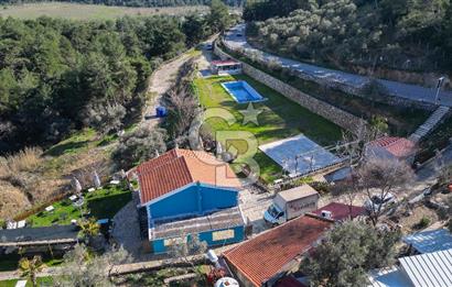 BUCA KAYNAKLAR BELENBAŞIN’DA İÇERİSİNDE RUHSATLI IŞLATME BULUNAN SATILIK 11 Dönüm TARLA 