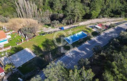 BUCA KAYNAKLAR BELENBAŞIN’DA İÇERİSİNDE RUHSATLI IŞLATME BULUNAN SATILIK 11 Dönüm TARLA 