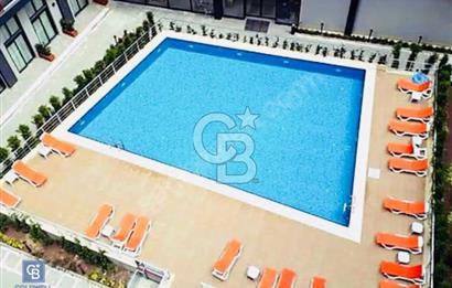 Bornova'da Güvenlikli Site Havuz Cephe Geniş Satılık 1+1 Daire