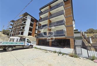 Kuşadası İkiçeşmelik'te Kiralık Köşe Konumlu Mağaza - 1 - 344156