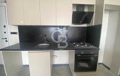 TAŞPINAR' DA SIFIR BİNA GİRİŞ KAT BAHÇE KULLANIMLI KİRALIK 1+1