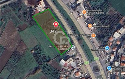 CB ODAK'TAN MENEMEN BURUNCUKTA YOLA CEPHELİ SATILIK 5.597M2