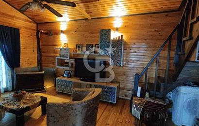 Muğla menteşe Denizova‘da satılık ahşap ev ve tarla