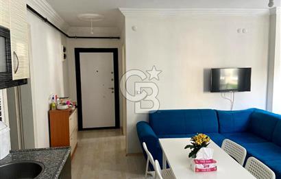 BUCA TINAZTEPE'DE KAMPÜS KARŞISI EŞYALI 1+1 SATILIK DAİRE