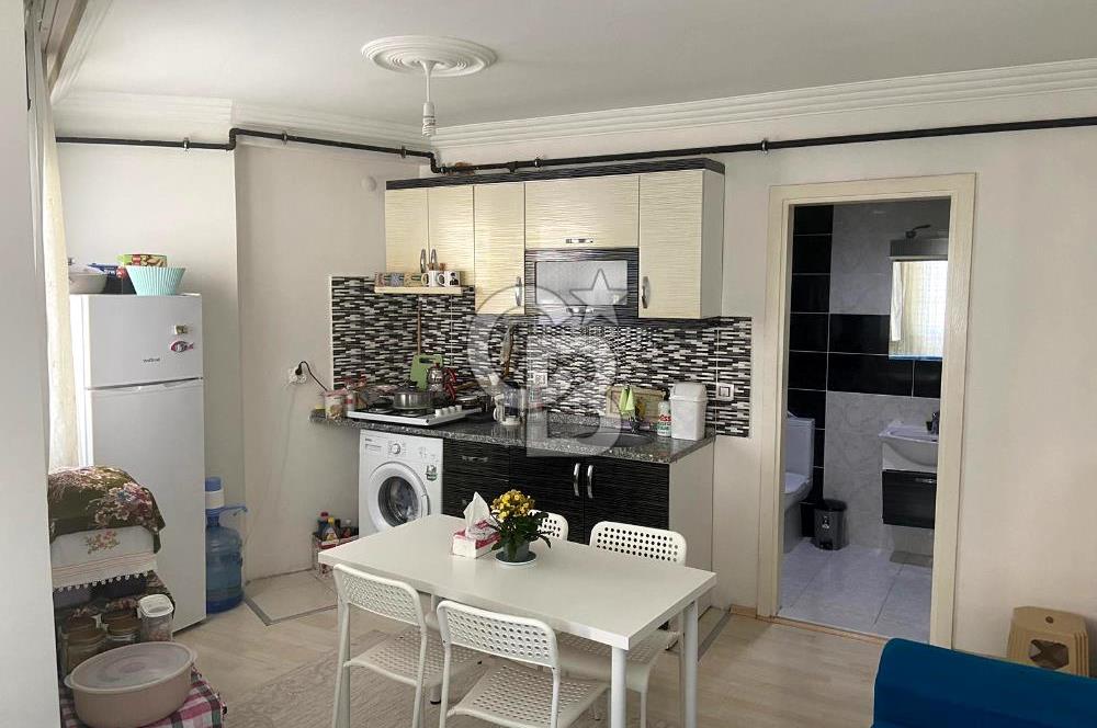 BUCA TINAZTEPE'DE KAMPÜS KARŞISI EŞYALI 1+1 SATILIK DAİRE