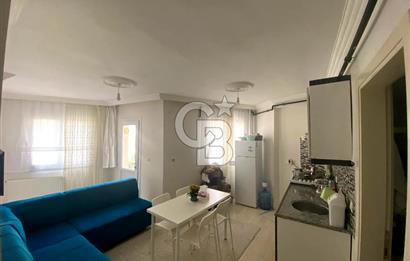 BUCA TINAZTEPE'DE KAMPÜS KARŞISI EŞYALI 1+1 SATILIK DAİRE