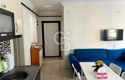 BUCA TINAZTEPE'DE KAMPÜS KARŞISI EŞYALI 1+1 SATILIK DAİRE