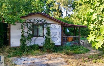 Ortaca Okçular'da Altyapılı Satılık Doğa Manzaralı AHŞAP EVİ OLAN Bahçe 