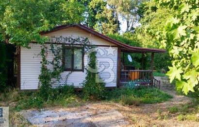 Ortaca Okçular'da Altyapılı Satılık Doğa Manzaralı AHŞAP EVİ OLAN Bahçe 