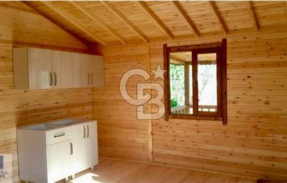 Ortaca Okçular'da Altyapılı Satılık Doğa Manzaralı AHŞAP EVİ OLAN Bahçe 