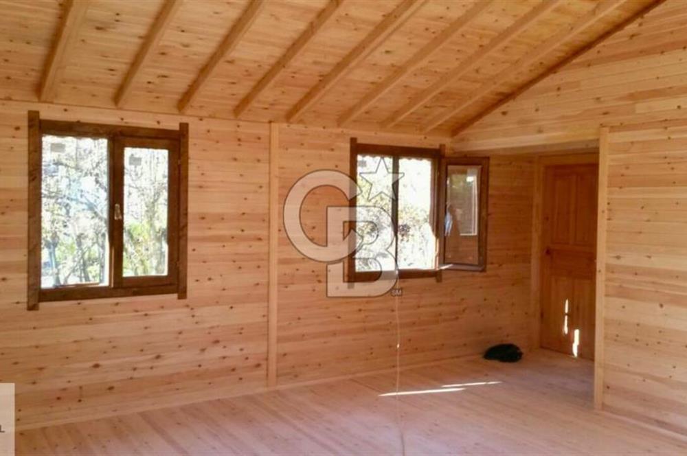 Ortaca Okçular'da Altyapılı Satılık Doğa Manzaralı AHŞAP EVİ OLAN Bahçe 