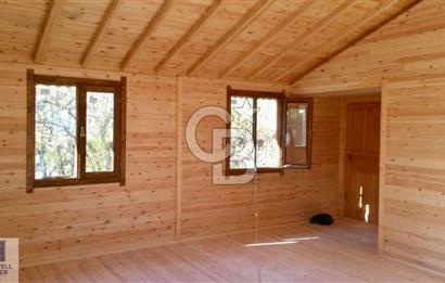 Ortaca Okçular'da Altyapılı Satılık Doğa Manzaralı AHŞAP EVİ OLAN Bahçe 