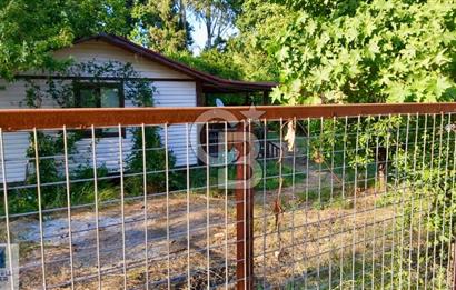 Ortaca Okçular'da Altyapılı Satılık Doğa Manzaralı AHŞAP EVİ OLAN Bahçe 