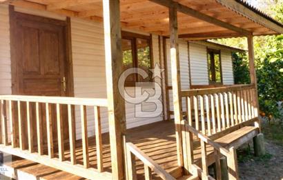 Ortaca Okçular'da Altyapılı Satılık Doğa Manzaralı AHŞAP EVİ OLAN Bahçe 