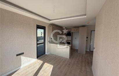 TURGUT ÖZAL MAHALLESİNDE SATILIK 1+1 TERASLI DAİRE