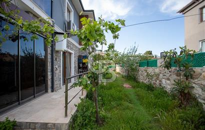 Foça Yenibağarası Mah. Satılık 2+1 Bahçe Katı Daire