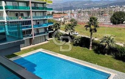 Bornova Park Evlerinde Havuz Cepheli Büyük Tip 1+1 Satılık Daire