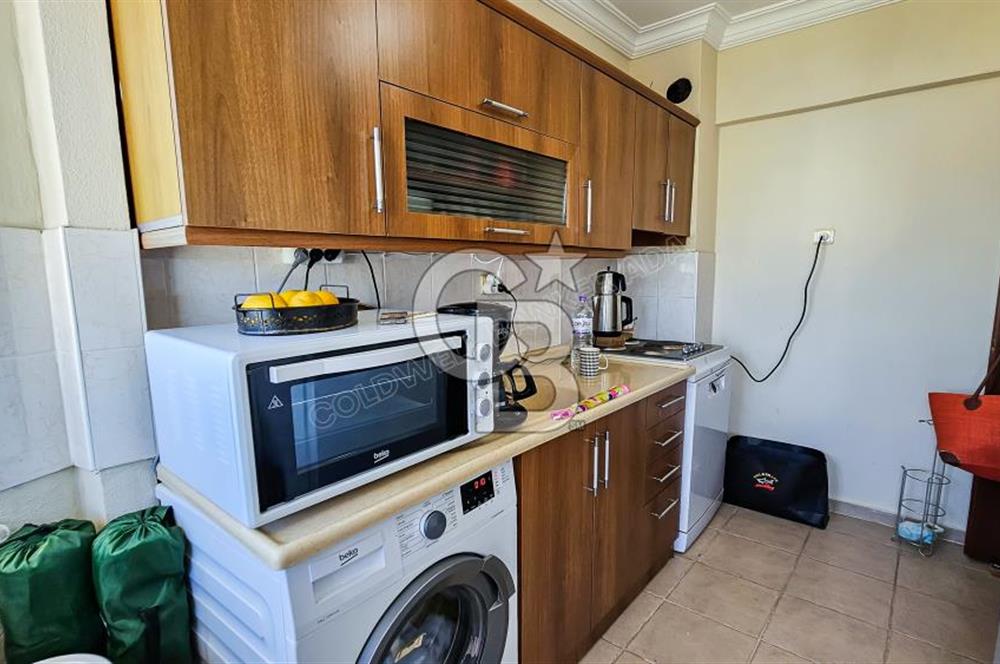Kuşadası'nda Merkezi Konumda Ayrı Mutfaklı Satılık 1+1 Daire