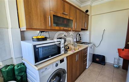 Kuşadası'nda Merkezi Konumda Ayrı Mutfaklı Satılık 1+1 Daire