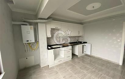 İZMİT ÇARŞI MERKEZ'DE ARA KAT 3+1 İÇİ YAPILI SATILIK DAİRE