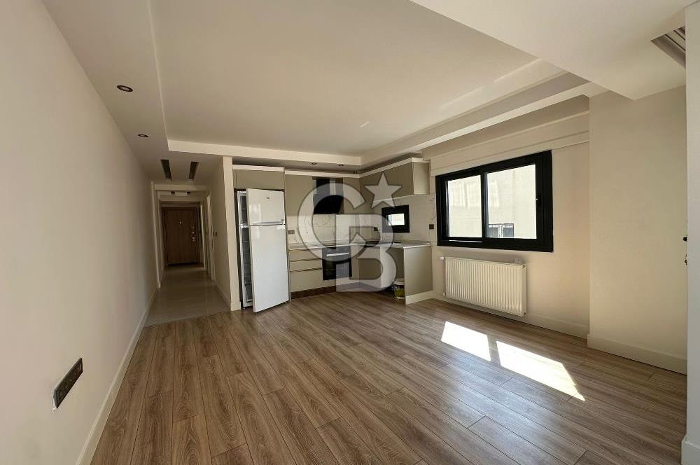 Karşıyaka Bostanlı'da Yeni Binada Bakımlı Kiralık Daire