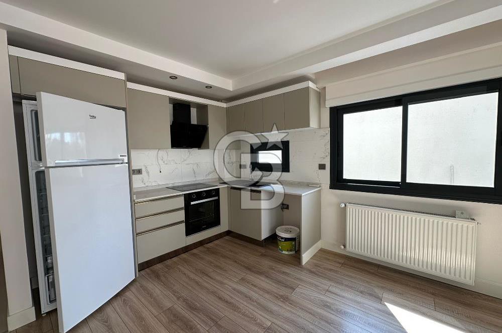 Karşıyaka Bostanlı'da Yeni Binada Bakımlı Kiralık Daire