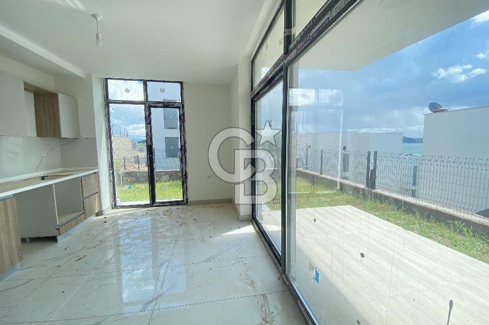 KIYIKIŞLACIK İASOS TA ATASAYANLAR PLAJLI SİTEDE 2 ADET 1+1 DAİRE