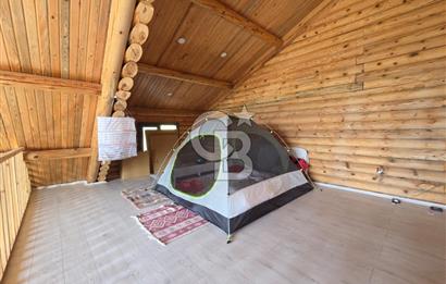 BORNOVA EĞRİDERE'DE 1000 M2 ARSA İÇİNDE AHŞAP BAĞ EVİ SATILIK