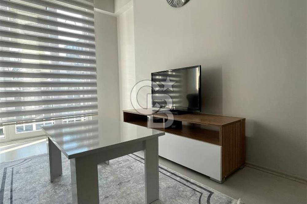 GÖRÜKLE DE MERKEZİ KONUMDA 1+1 EŞYALI SATILIK KİRACISIZ DAİRE