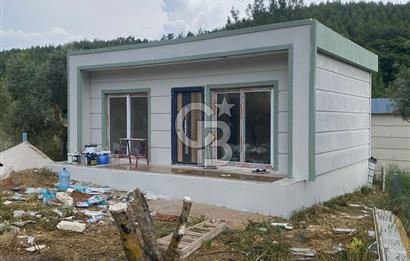 TORBALI ORMANKÖY’DE ÇELİK EV BULUNAN SATILIK TARLA HİSSESİ