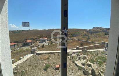 SEFERİHİSAR TEPECİK'TE TEMELİ ATILMIŞ 14 AY SONRA TESLİM SATILIK KOOPERATİF HİSSELİ KONUT ARSASI 