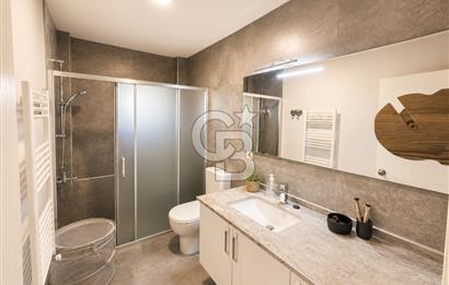 OLİMPİYAT KÖYÜNDE GENİŞ TERASLI MODERN 3+1 KISMİ EŞYALI SATILIK