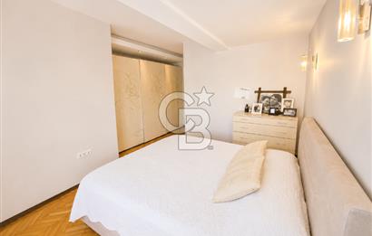 OLİMPİYAT KÖYÜNDE GENİŞ TERASLI MODERN 3+1 KISMİ EŞYALI SATILIK